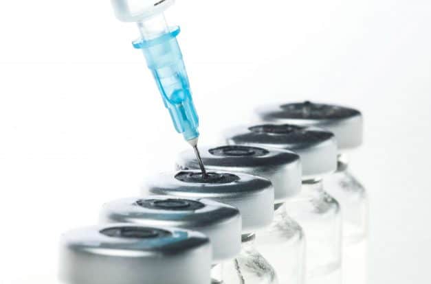 Needle Inserting into Bottles of TriMix Injections