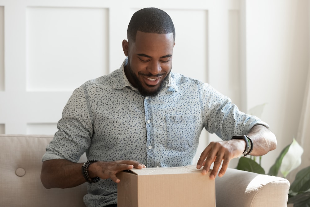 Man unpacking a box of TriMix injections he ordered online