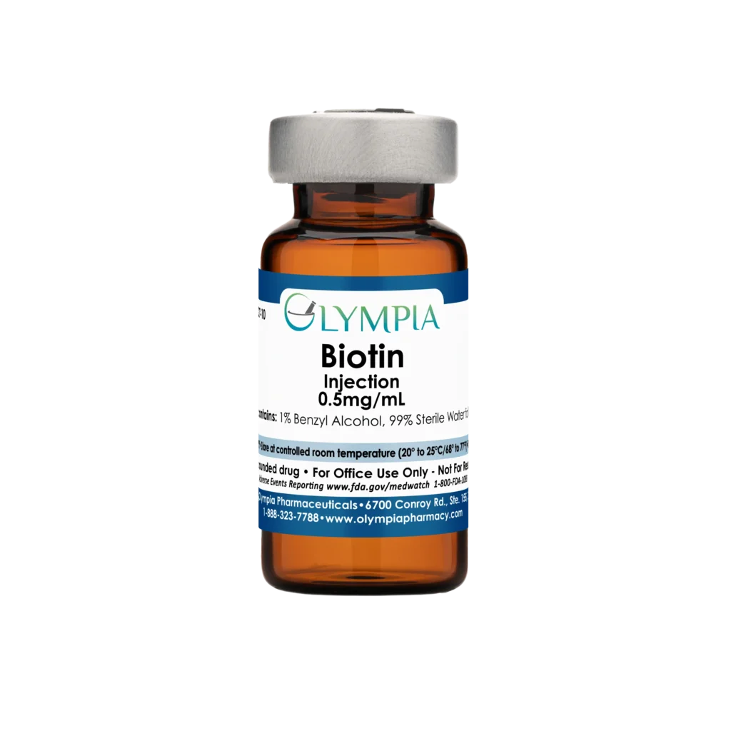 A vial of compounded medication from Olympia. The vial is amber, has a silver cap, and a blue label, reading "Olympia Biotin Injection."