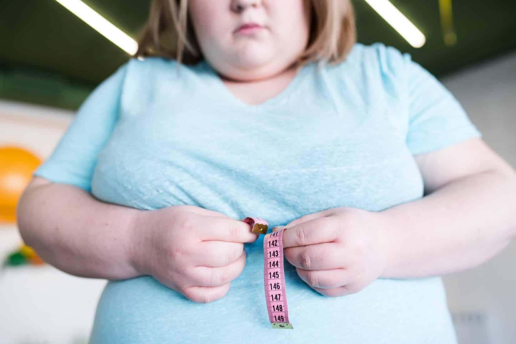 Obese Woman Measuring Waist