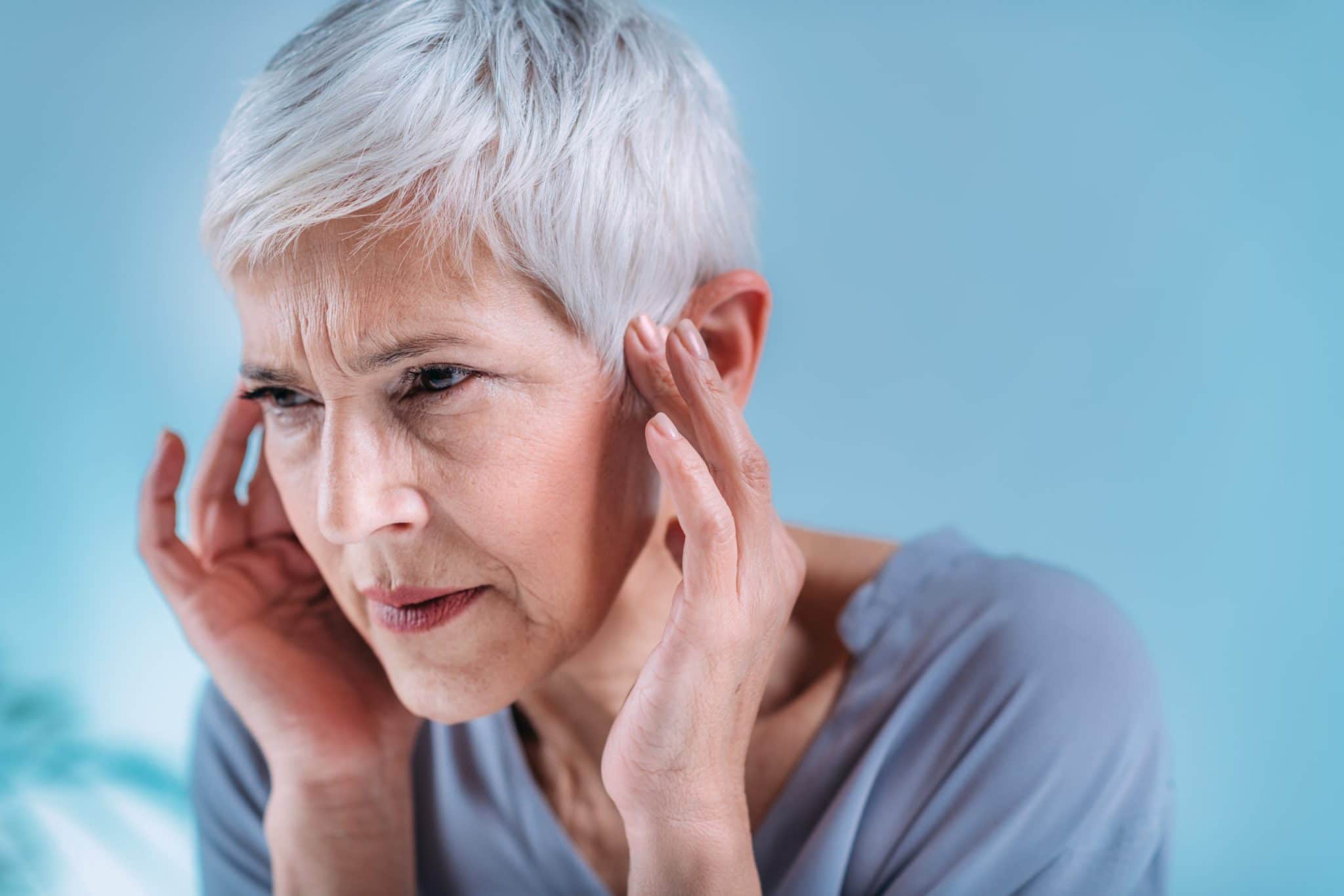 woman suffering from tinnitus due to B12 deficiency