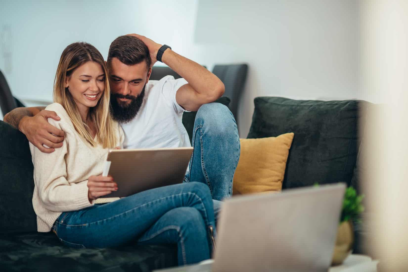 Man and woman using tablet to research ED