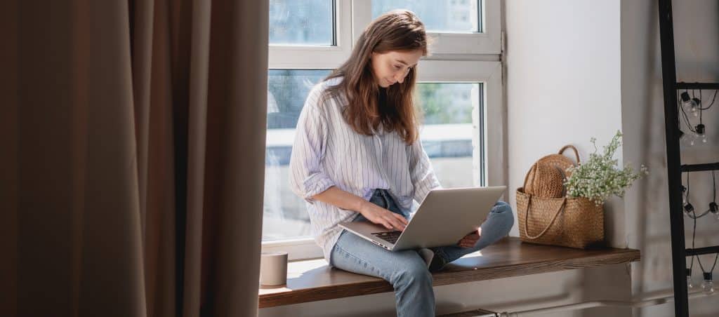 Woman researching ED on her laptop