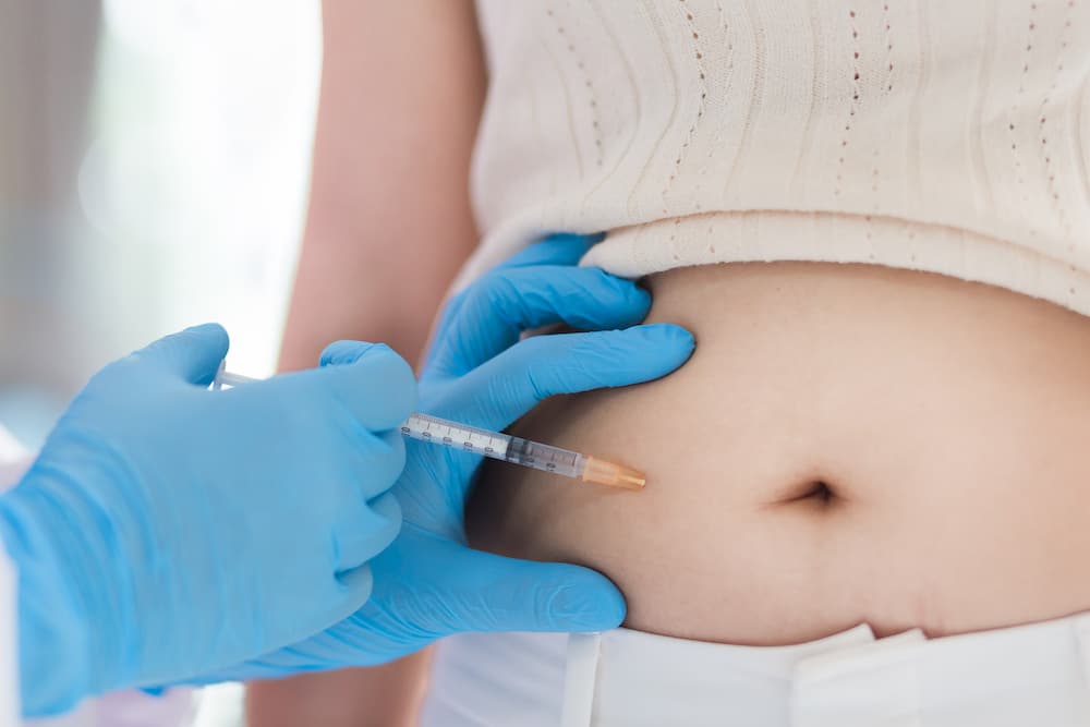 medical professional administering weight loss injections