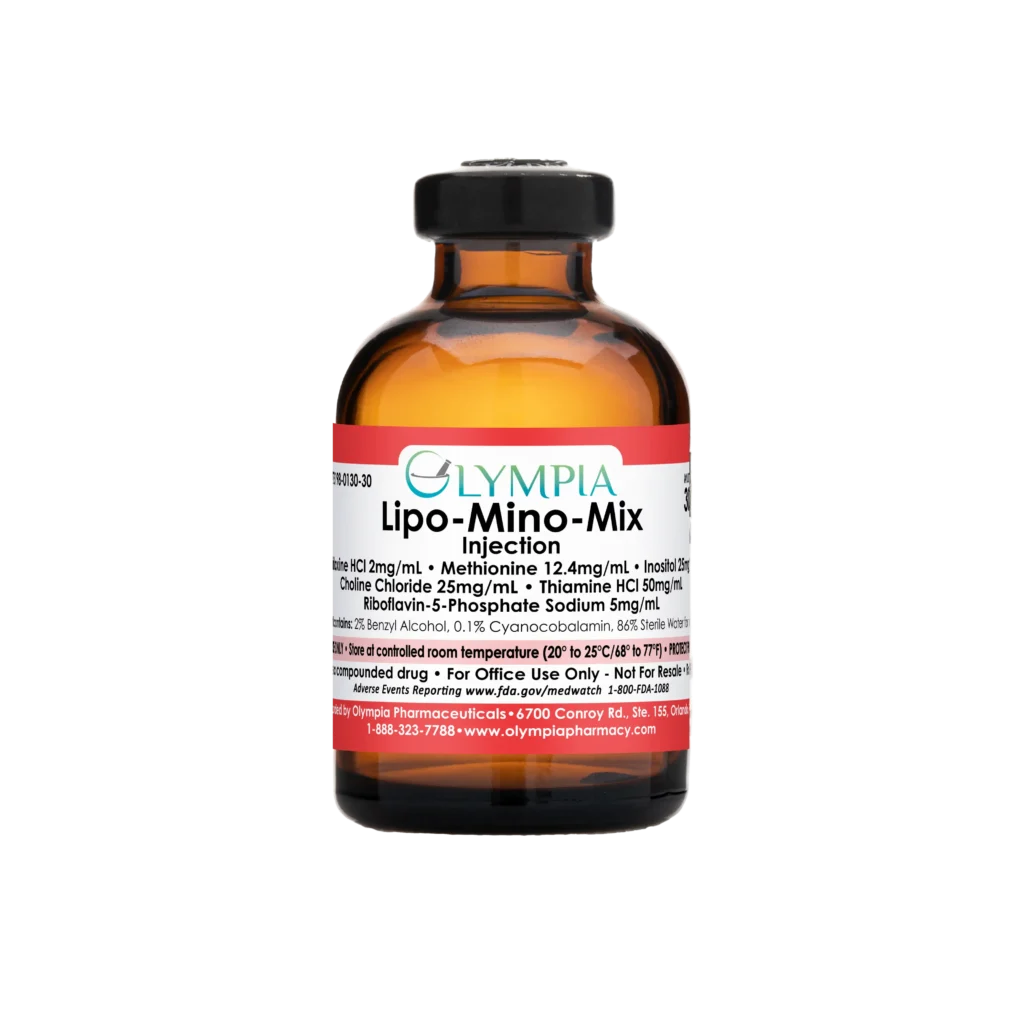 A vial of compounded lipotropic medication from Olympia. The vial is amber, has a black cap, and a red label that reads "Olympia Lipo-Mino-Mix Injection."