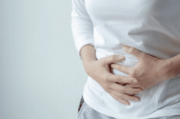 A person holding their stomach.