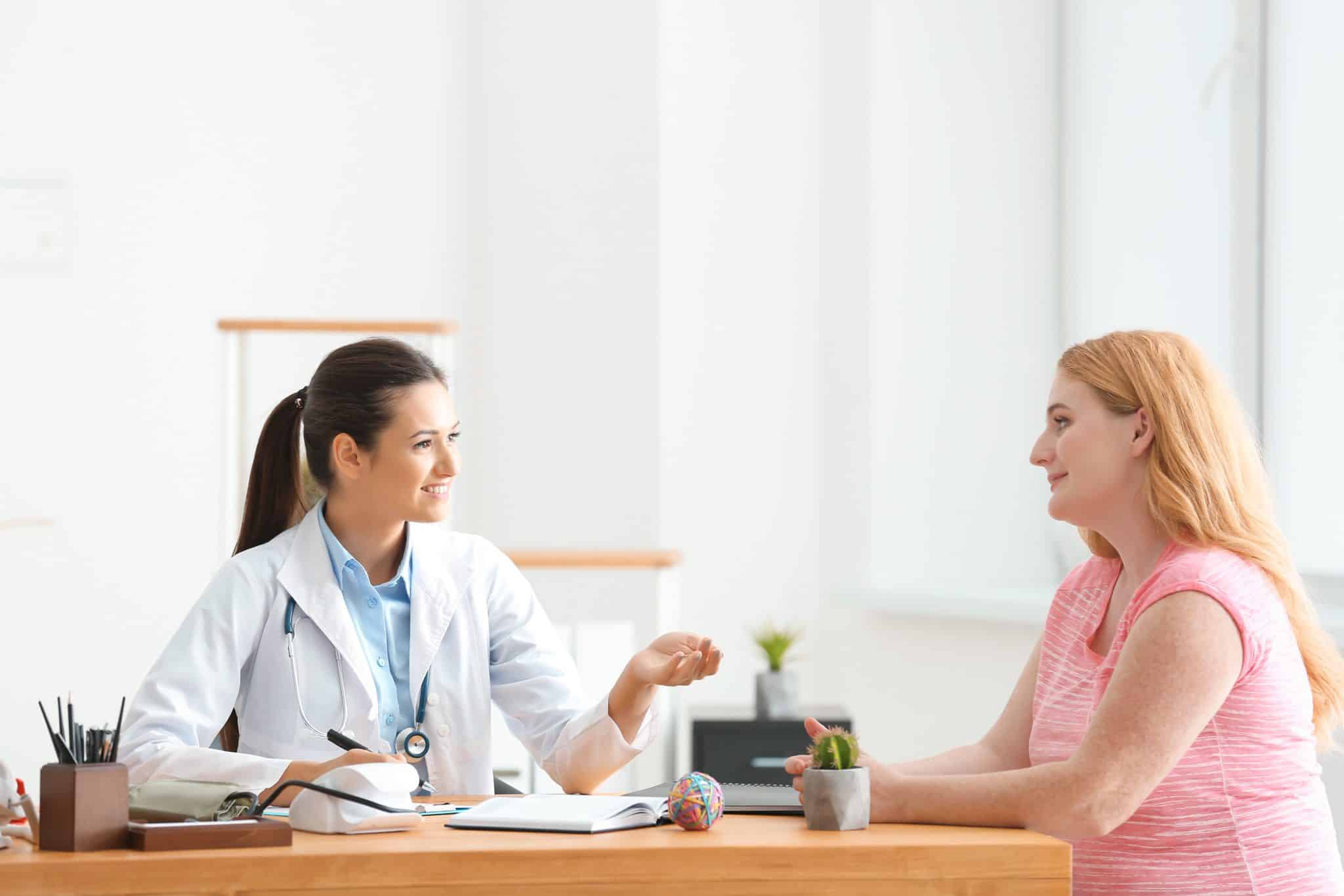 weight loss clinic doctor talking to a patient who was referred