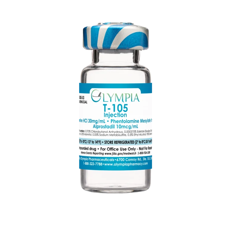 A vial of compounded Trimix ED medication from Olympia. The vial has a blue-white striped cap and a blue label that reads "Olympia T-105 Injection."