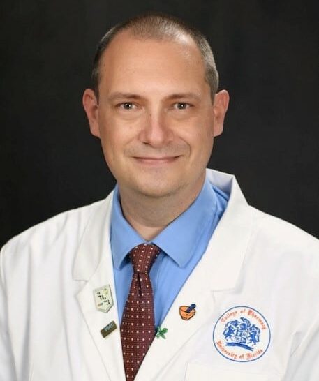A headshot of a Male pharmacist