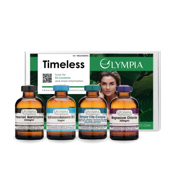 A white box with a green label. The title reads "Timeless." A QR code is visible, linking to the Timeless IV Kit webpage on Olympia's website. Green accents line the top and bottom of the box, and between them, a woman can be seen amidst lush, green leaves. In front of the box are four vials of medication: a black one labeled "Preserved Acetylcysteine," a light blue one labeled "Hydroxocobalamin B12," a teal one labeled "Olympia Vita-Complex," and a purple one labeled "Magnesium Chloride."