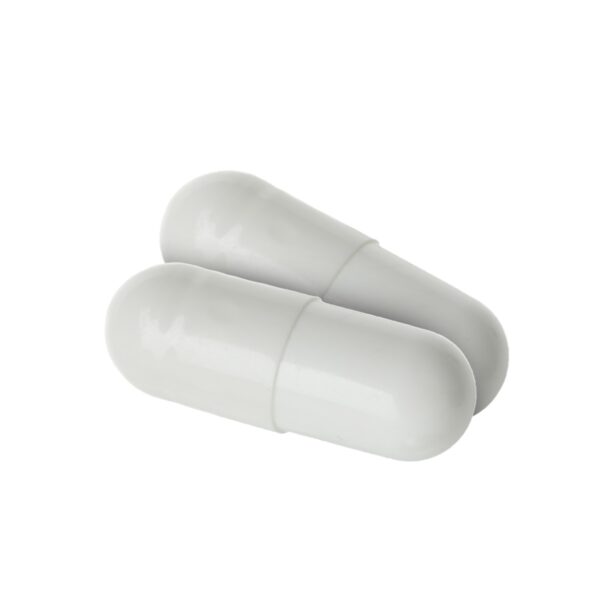 Two white enclomiphene capsules on a white background.