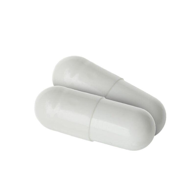 Two white enclomiphene capsules on a white background.