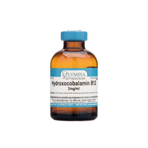 Amber vial labeled "Olympia Pharmaceuticals Hydroxocobalamin B12, 2mg/ml," containing an injectable form of vitamin B12 used for nutritional support or deficiency management.