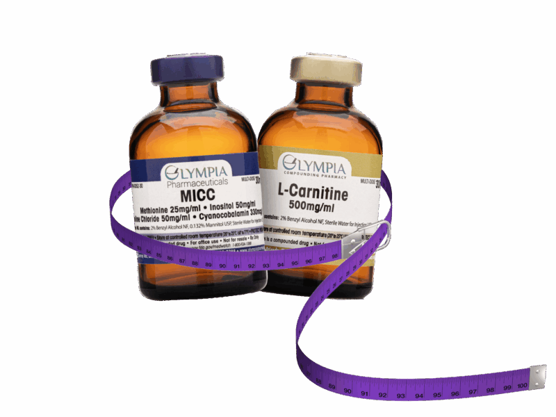 Two amber-colored vials labeled "MICC" and "L-Carnitine 500mg/ml" from Olympia Compounding Pharmacy, wrapped with a coiled purple measuring tape.