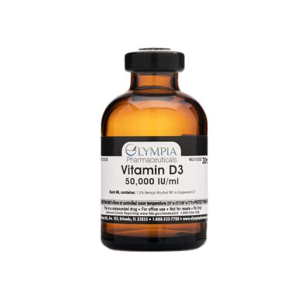 Amber glass vial labeled "Olympia Pharmaceuticals Vitamin D3, 50,000 IU/ml," containing a compounded injectable vitamin D3 solution. The label includes usage details and storage instructions.