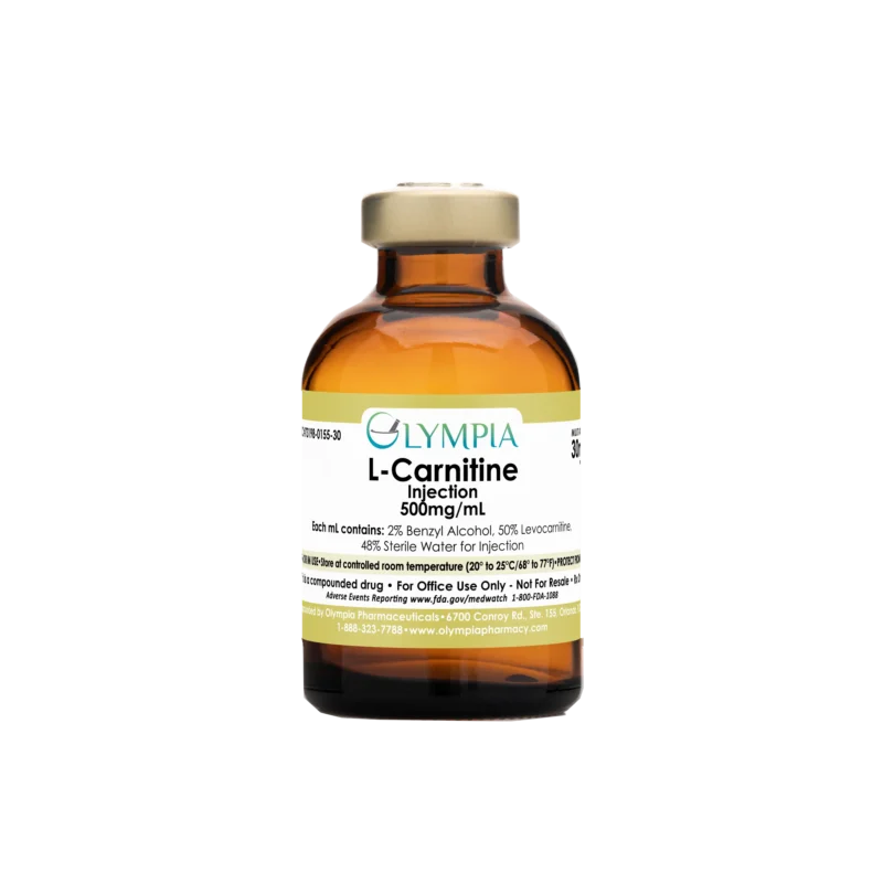 A vial of compounded injectable medication from Olympia. The vial is amber, and has a gold cap and a gold label that reads "Olympia L-Carnitine Injection 500mg/mL."