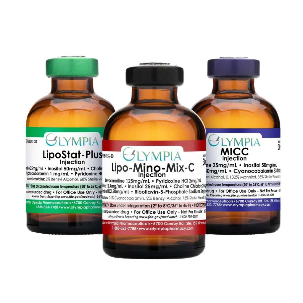 An array of three compounded lipotropic injectable medications from Olympia. From left to right, an amber vial with a green cap and label that reads "Olympia LipoStat-Plus" Injection, an amber vial with a black cap and red label that reads "Olympia Lipo-Mino-Mix-C Injection," an amber vial with a purple cap and label that reads "Olympia MICC Injection."