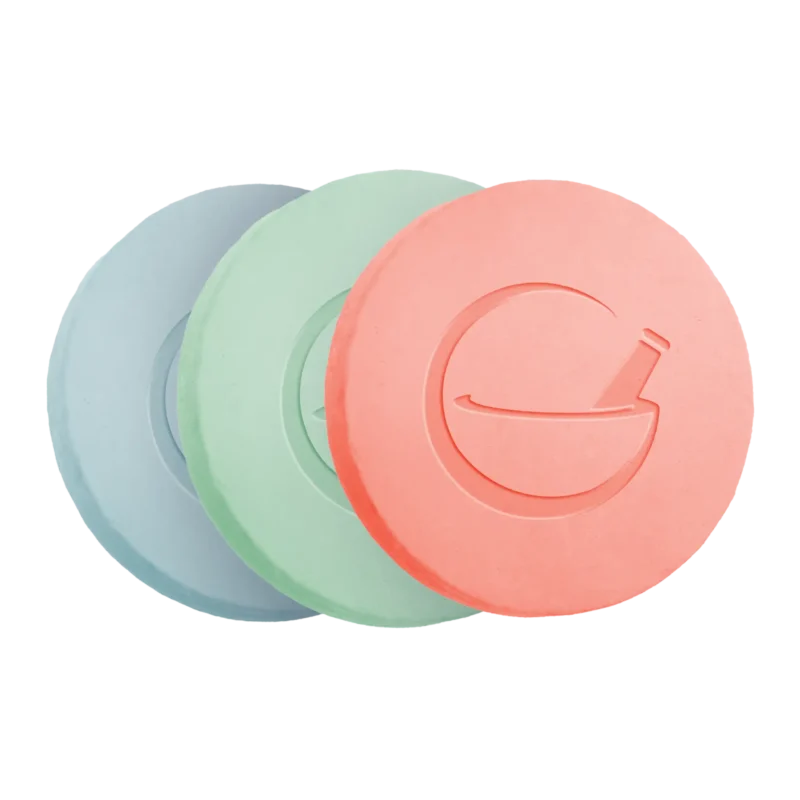 Three tablets of Naltrexone HCl stacked atop each other. A blue, green, and red tablet can be seen, each imprinted with the Olympia mortar and pestle.