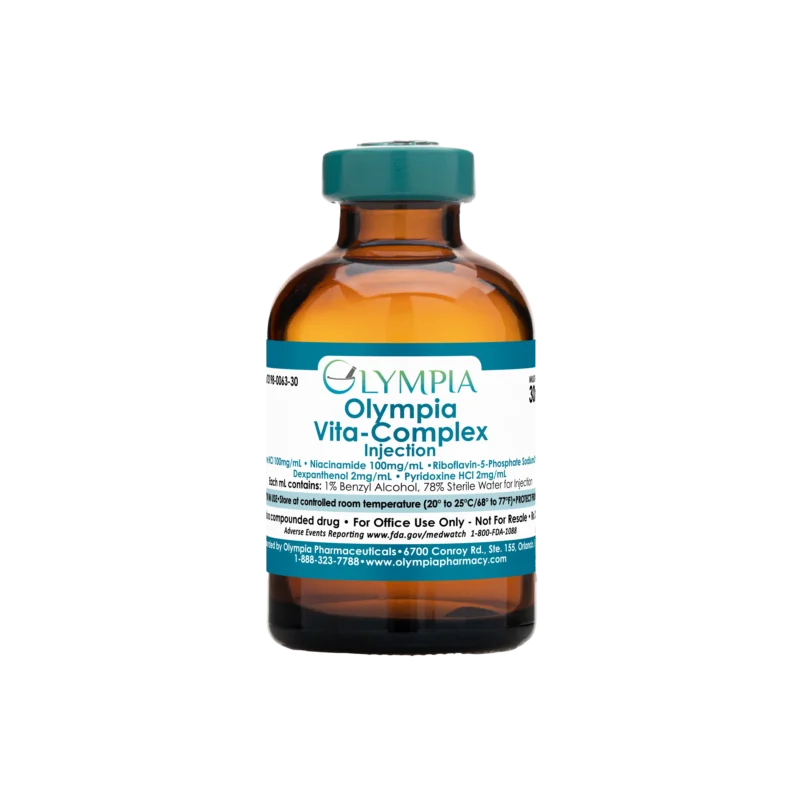 A vial of compounded medication from Olympia. The vial is amber with a teal cap and label, and the label reads "Olympia Vita-Complex Injection."