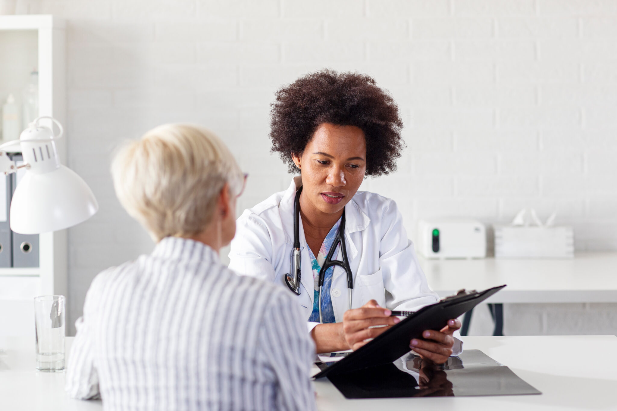 A doctor discusses magnesium chloride supplementation with an older female patient.